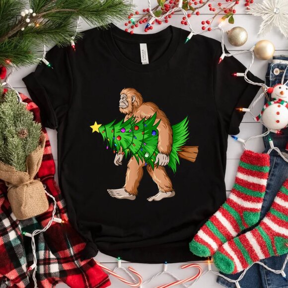 Bigfoot Carrying Christmas Tree Sasquatch Christmas TShirt - Picture 1 of 1